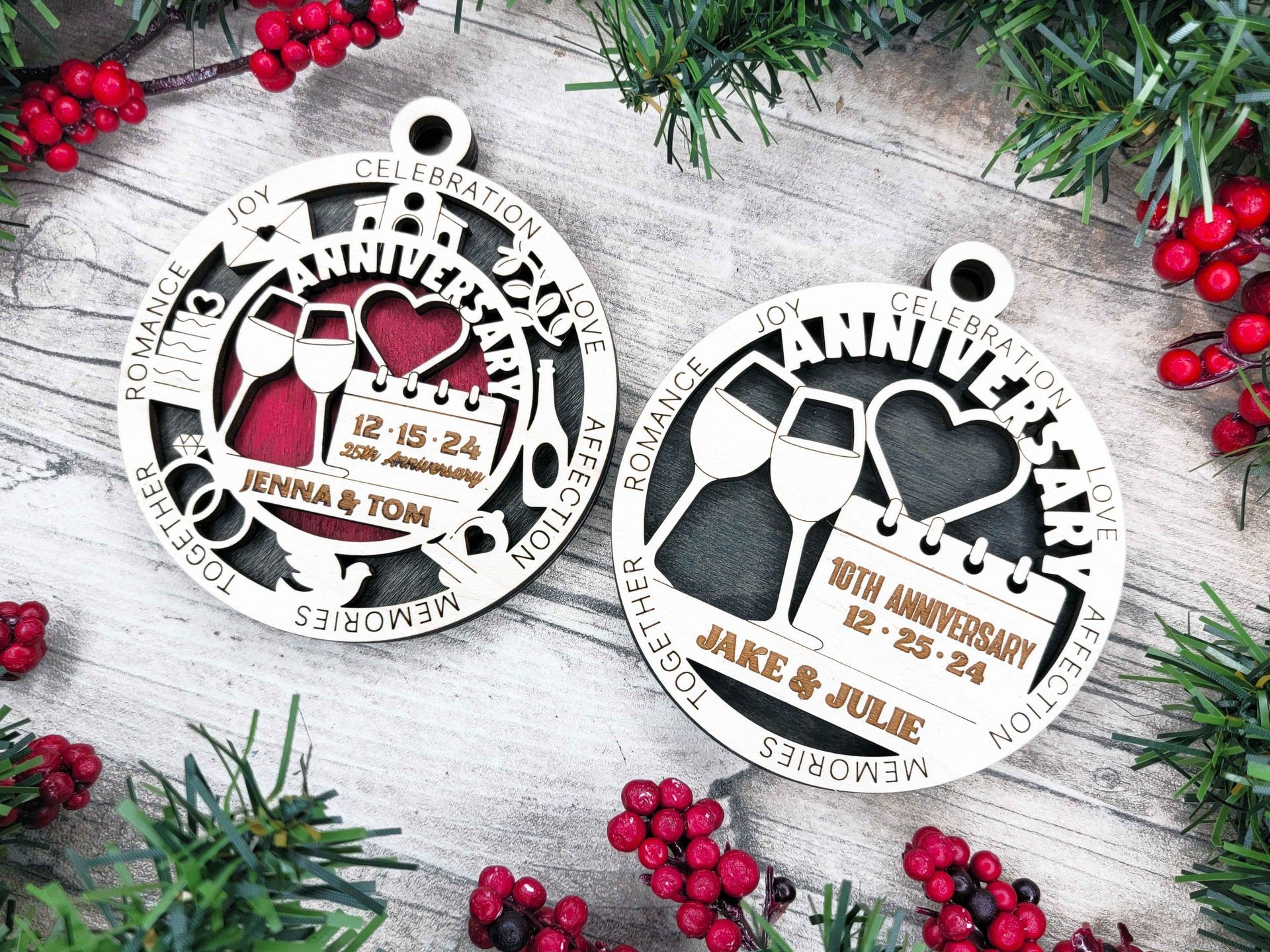 Two circular anniversary ornaments with engraved names and dates, surrounded by holiday decorations like berries and greenery.